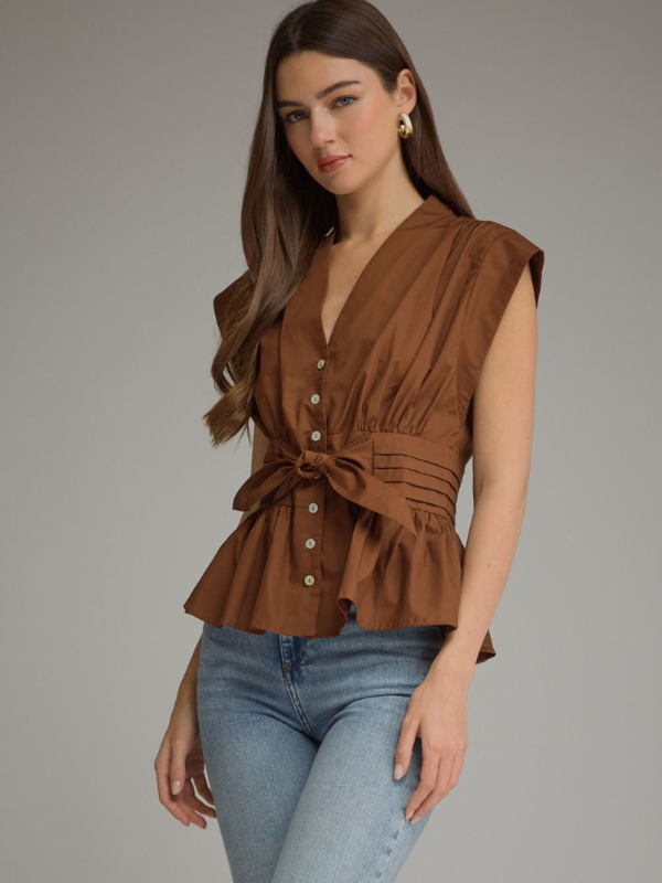 woman wearing a soft brown tie top with jeans 