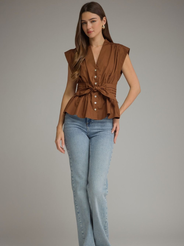 woman wearing a soft brown tie top with jeans 