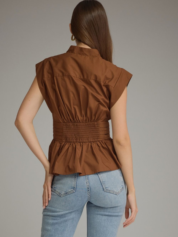 woman wearing a soft brown tie top with jeans 