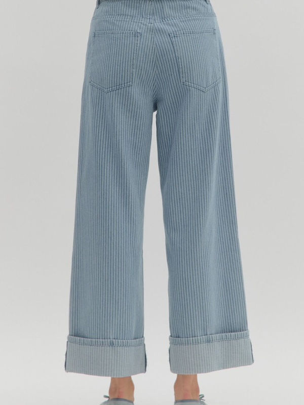 Light blue striped pants on a gray background