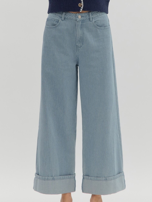 Light blue striped wide-leg pants on a light gray background