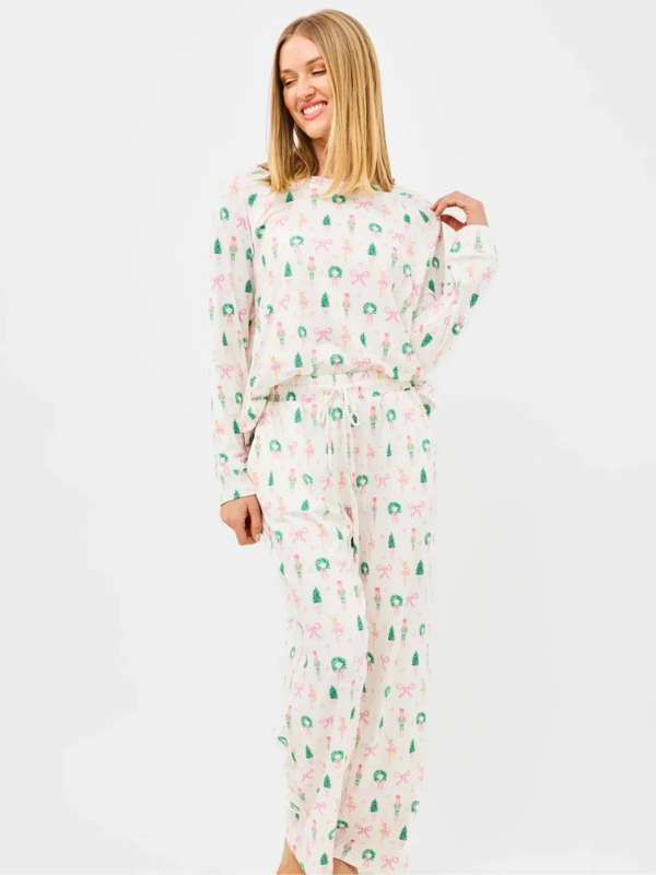 Woman wearing a floral nightgown on a white background