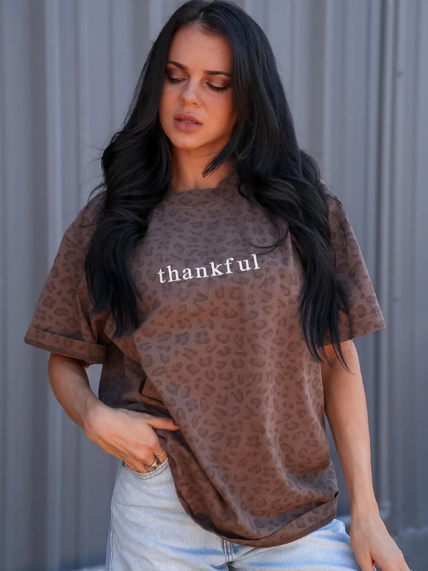 woman wearing a thankful leopard tee