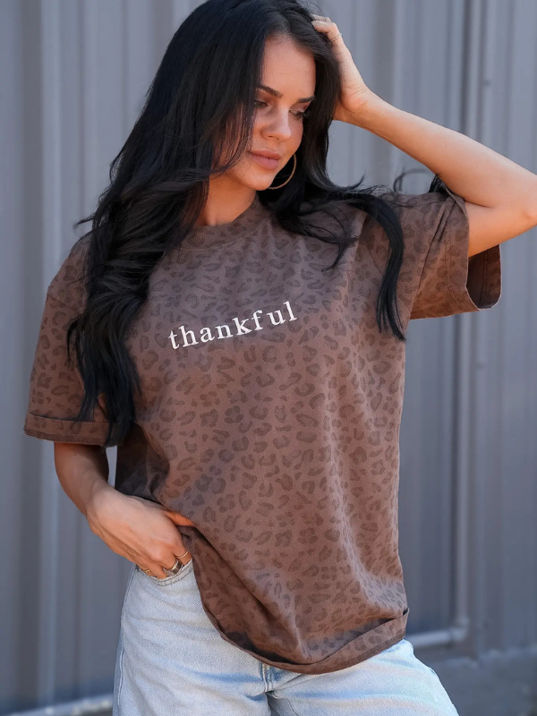 woman wearing a thankful leopard tee
