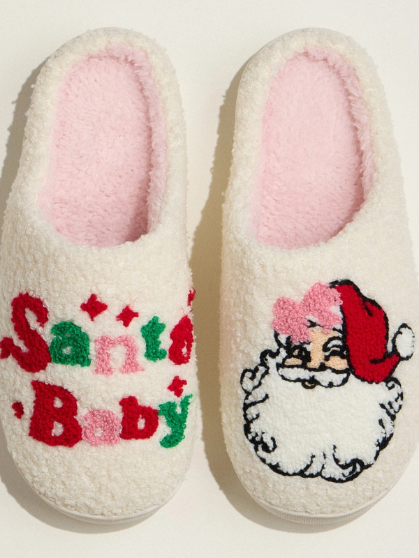 Pair of slippers with 'Santa Baby' text and a Santa Claus design on a light background