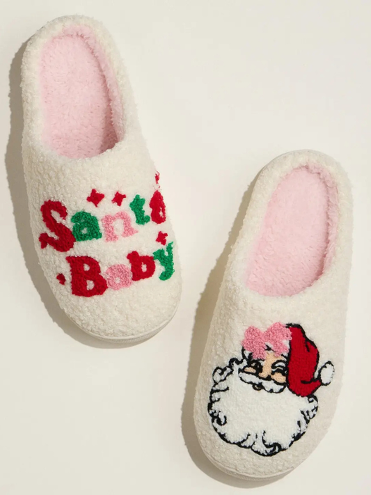 Pair of slippers with 'Santa Baby' text and Santa Claus illustration on a light background
