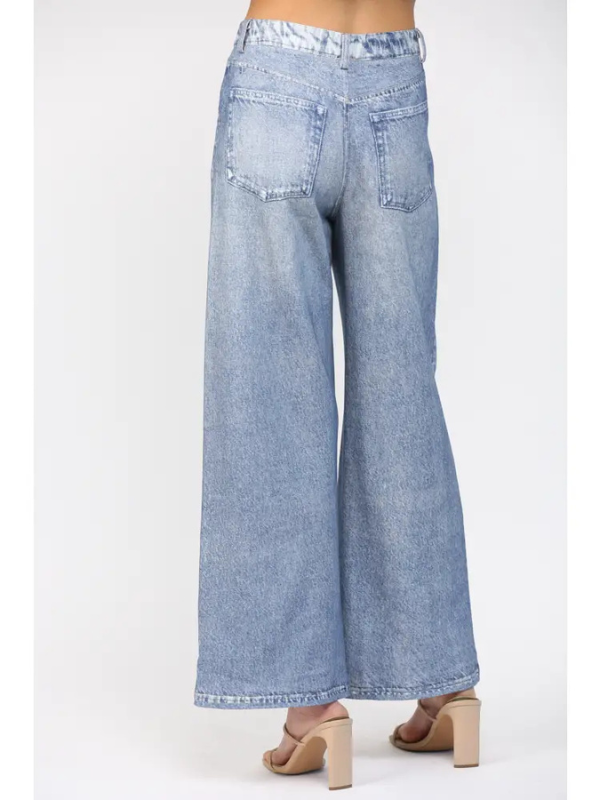 Light blue wide-leg jeans on a white background