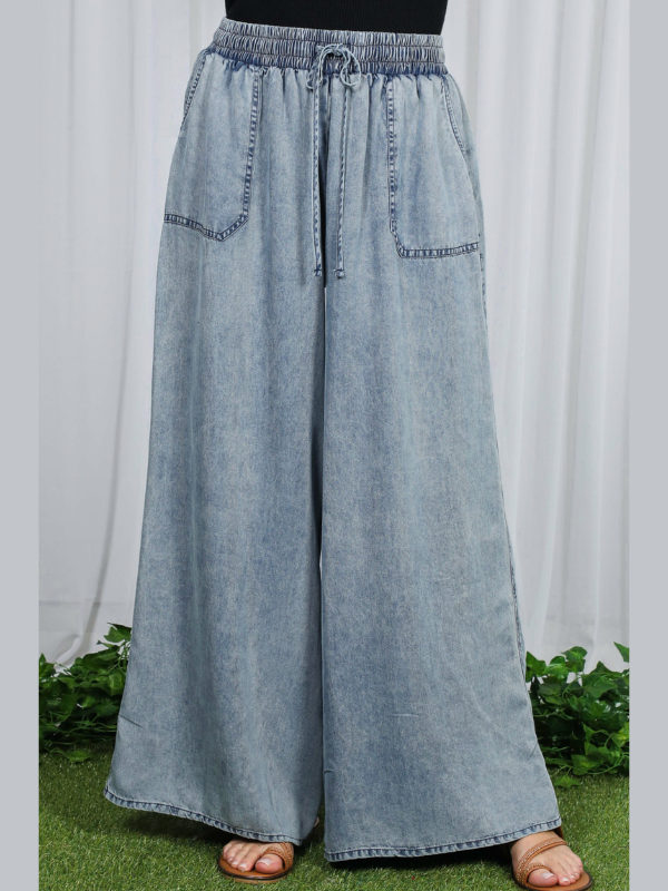 Light blue denim wide-leg pants on a white background