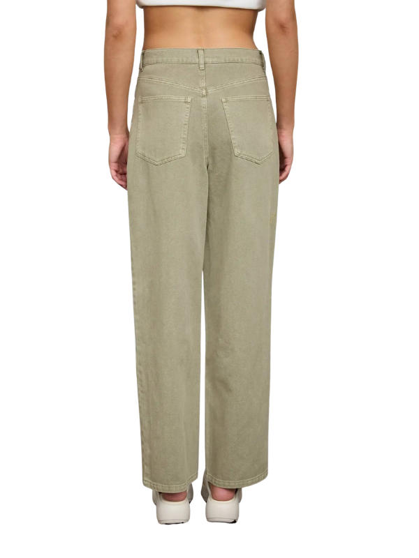 Person wearing light green pants on a white background