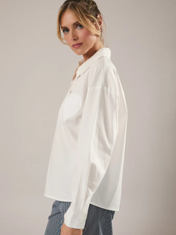 Woman wearing a white blouse with a neutral background